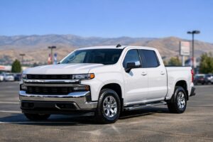 A white pickup truck with a clean appearance parked in a Boise dealership lot, photographed as an object for an article about diminished auto value claims in Idaho.